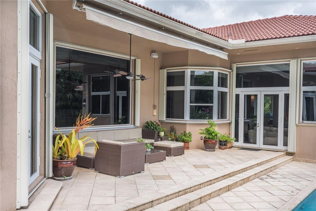 3620 Paddock Road Weston, FL 33331 - Photo 39 of 51 a view of a house with outdoor seating
