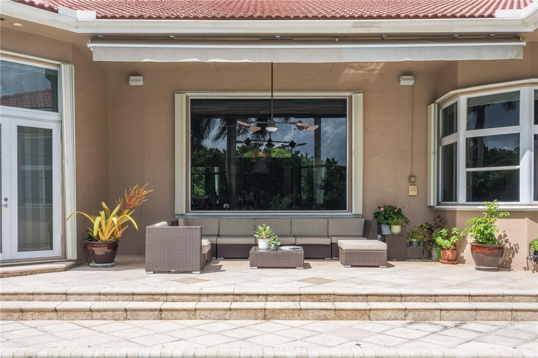 3620 Paddock Road Weston, FL 33331 - Photo 42 of 51 a living room with furniture and a potted plant