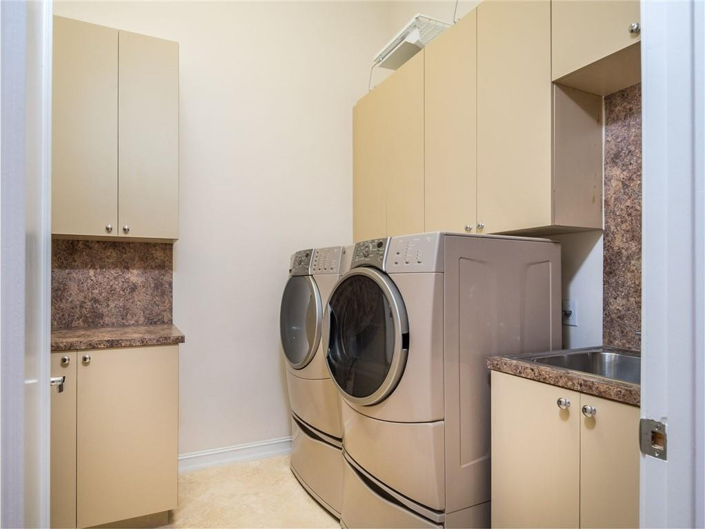 3620 Paddock Road Weston, FL 33331 - Photo 44 of 51 a utility room with dryer and washer