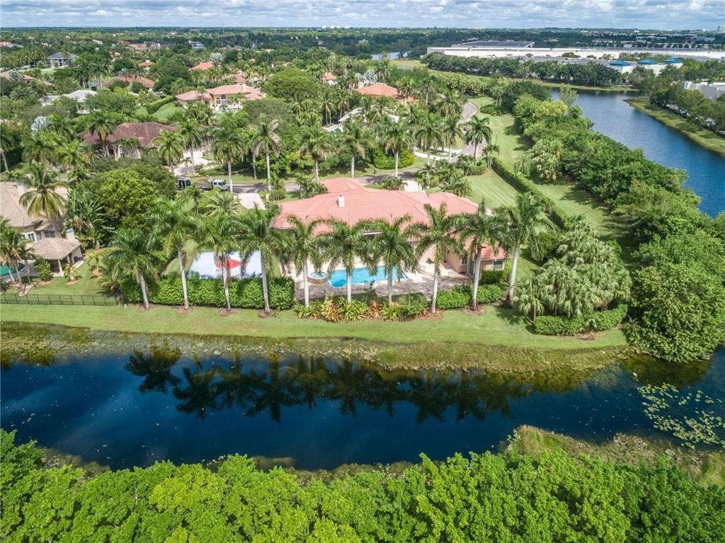 3620 Paddock Road Weston, FL 33331 - Photo 49 of 51 a view of a garden with a lake