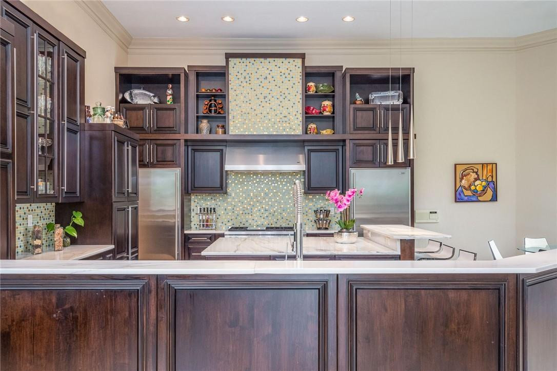 3620 Paddock Road Weston, FL 33331 - Photo 9 of 51 a kitchen with stainless steel appliances granite countertop a sink and a refrigerator