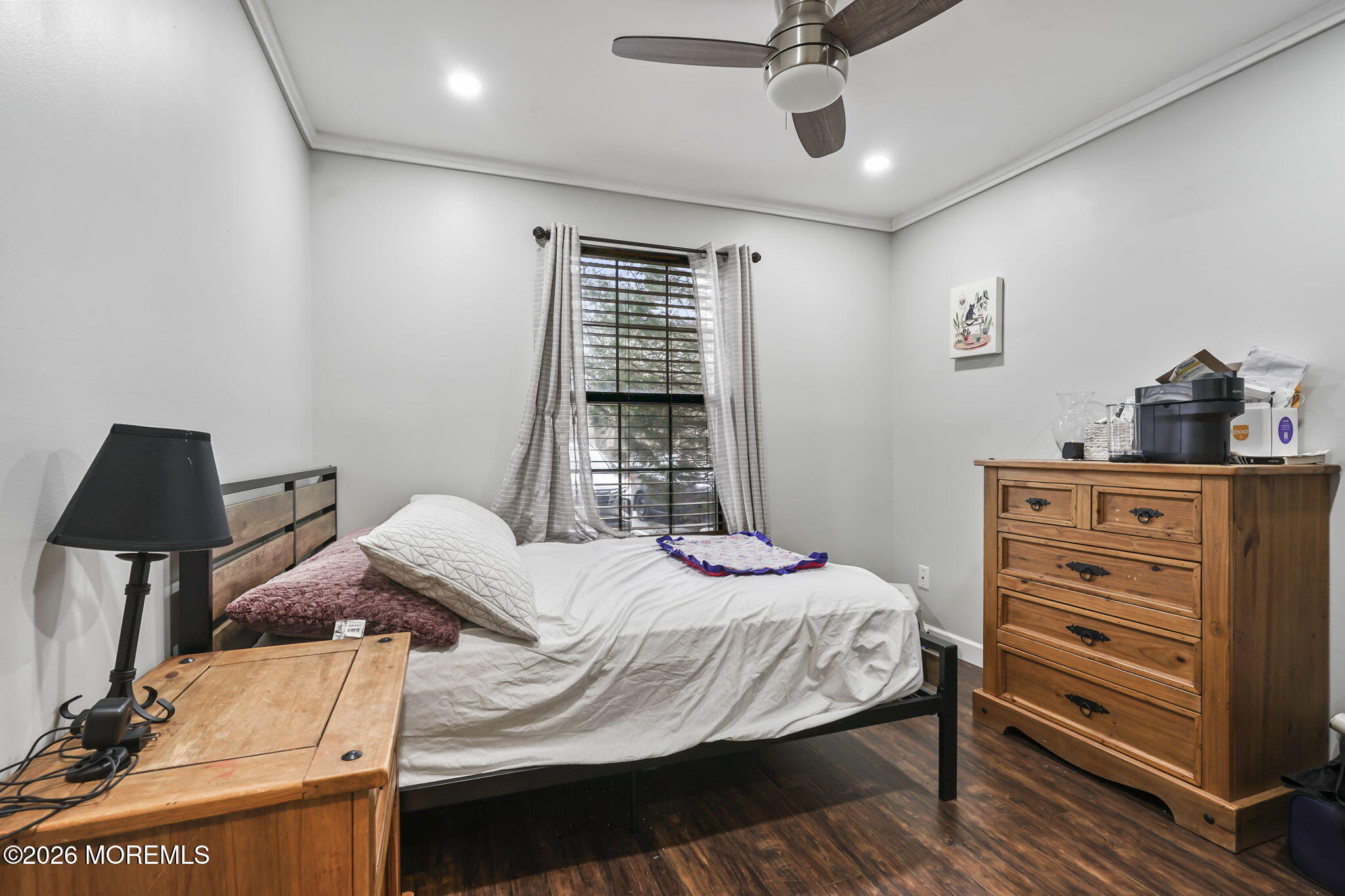 402 Daisy Court Jackson, NJ 08527 - Photo 12 of 16 a bedroom with a bed and a chandelier