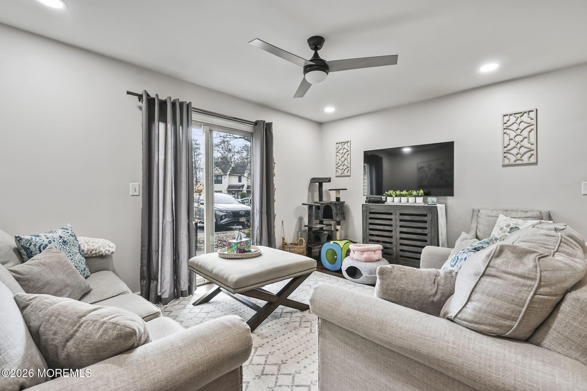 402 Daisy Court Jackson, NJ 08527 - Photo 5 of 16 a living room with furniture and a flat screen tv