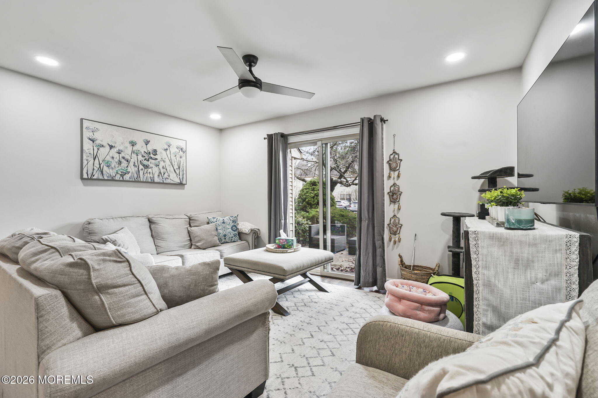 402 Daisy Court Jackson, NJ 08527 - Photo 6 of 16 a living room with furniture and a large window