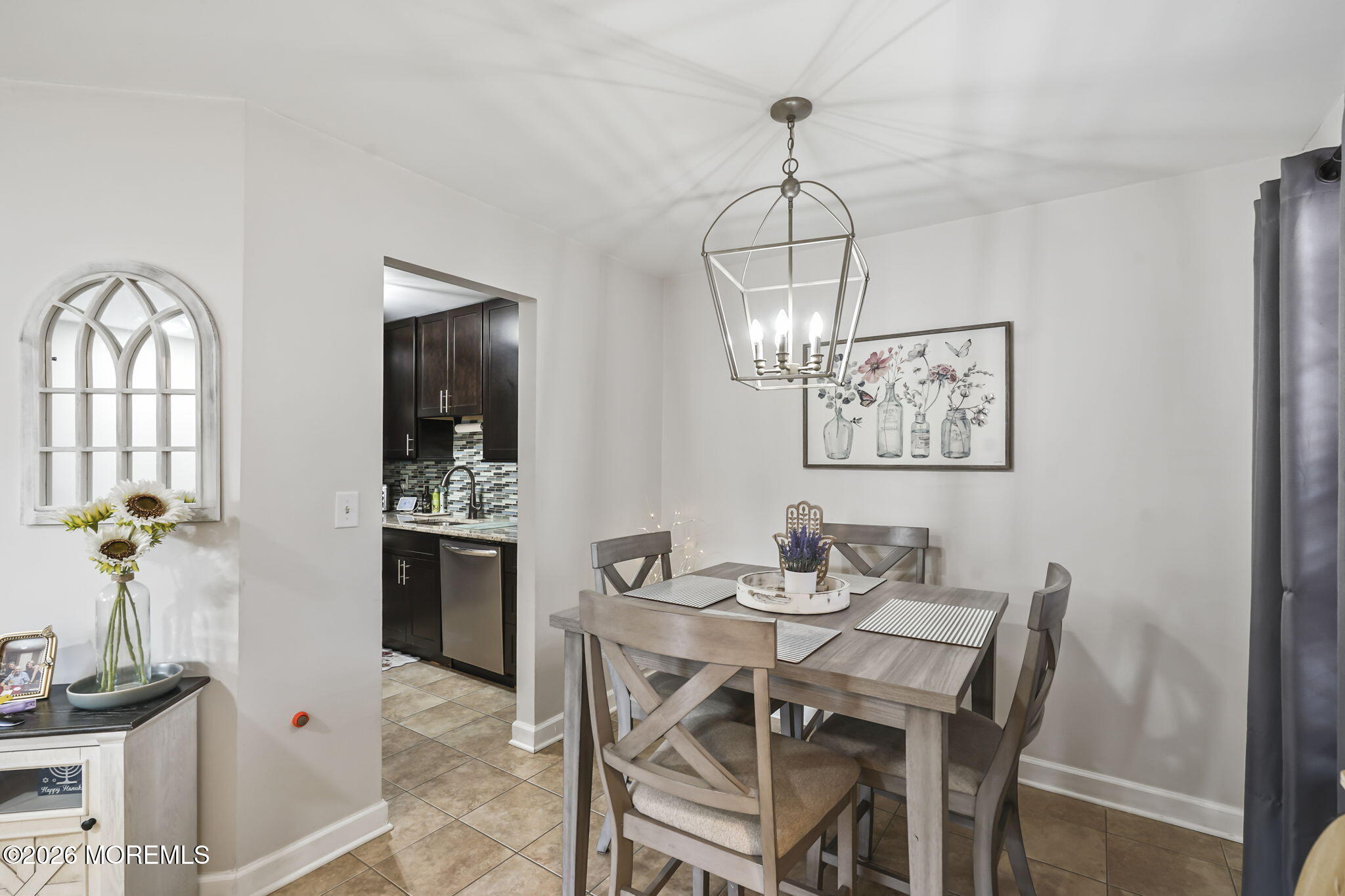402 Daisy Court Jackson, NJ 08527 - Photo 8 of 16 a view of a dining room with furniture window and wooden floor