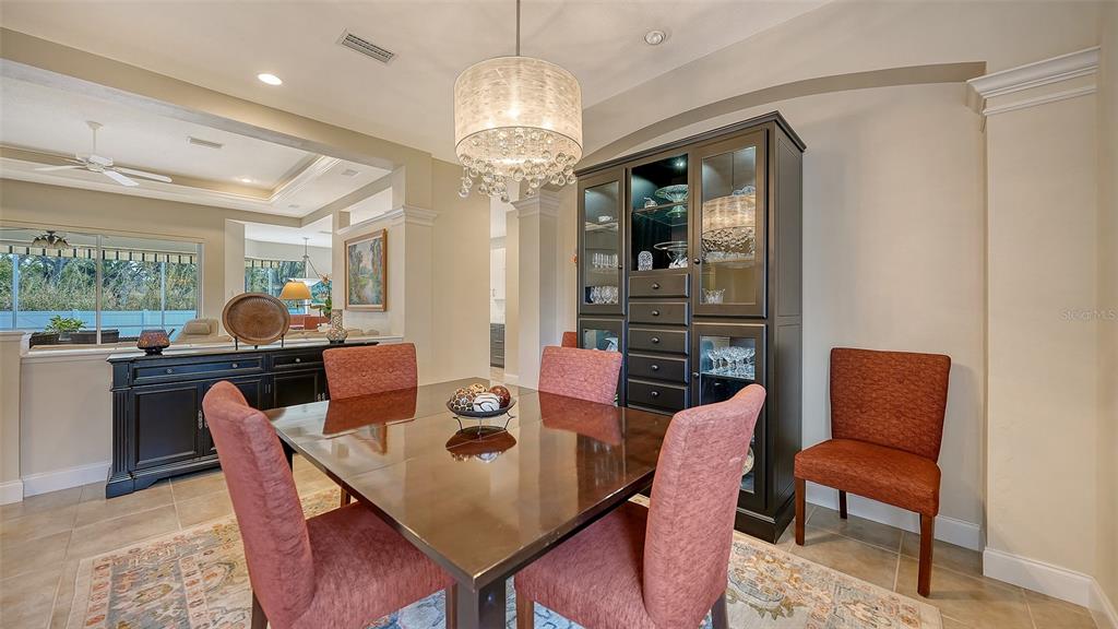 4855 Carrington Circle Sarasota, FL 34243 - Photo 12 of 58 a view of a dining room with furniture window and outside view