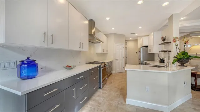 a kitchen with a sink and cabinets