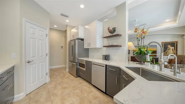 a view of a dining room with furniture wooden floor and a chandelier