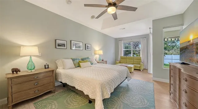 a bedroom with a bed and a lamp