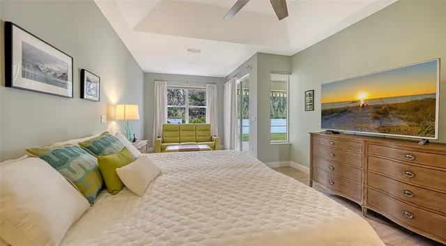 a spacious bathroom with a double vanity sink large mirror and a bathtub