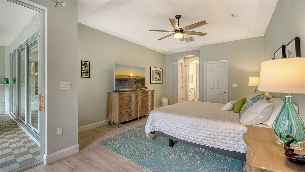4855 Carrington Circle Sarasota, FL 34243 - Photo 25 of 58 a living room with furniture and a chandelier