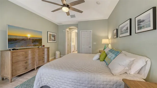 a spacious bathroom with a double vanity sink mirror and shower
