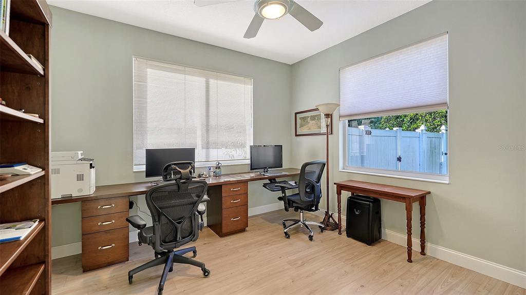 4855 Carrington Circle Sarasota, FL 34243 - Photo 38 of 58 a view of a workspace with furniture and a window