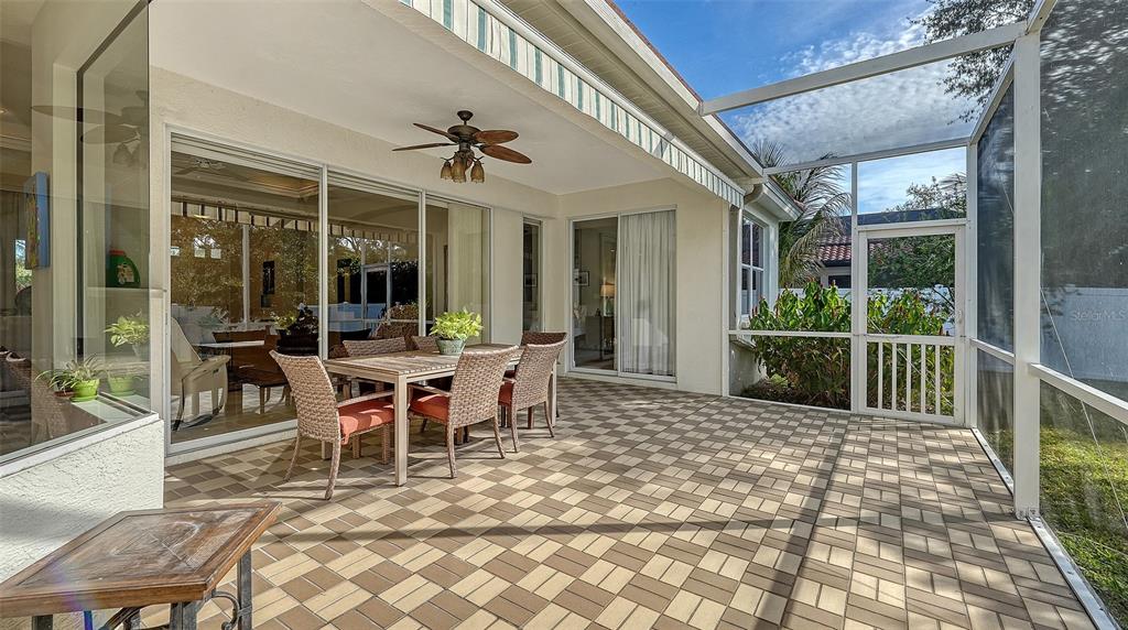 4855 Carrington Circle Sarasota, FL 34243 - Photo 45 of 58 a view of a patio with a dining table and chairs