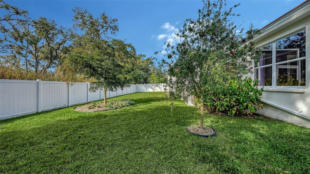 4855 Carrington Circle Sarasota, FL 34243 - Photo 49 of 58 a view of a backyard with wooden fence