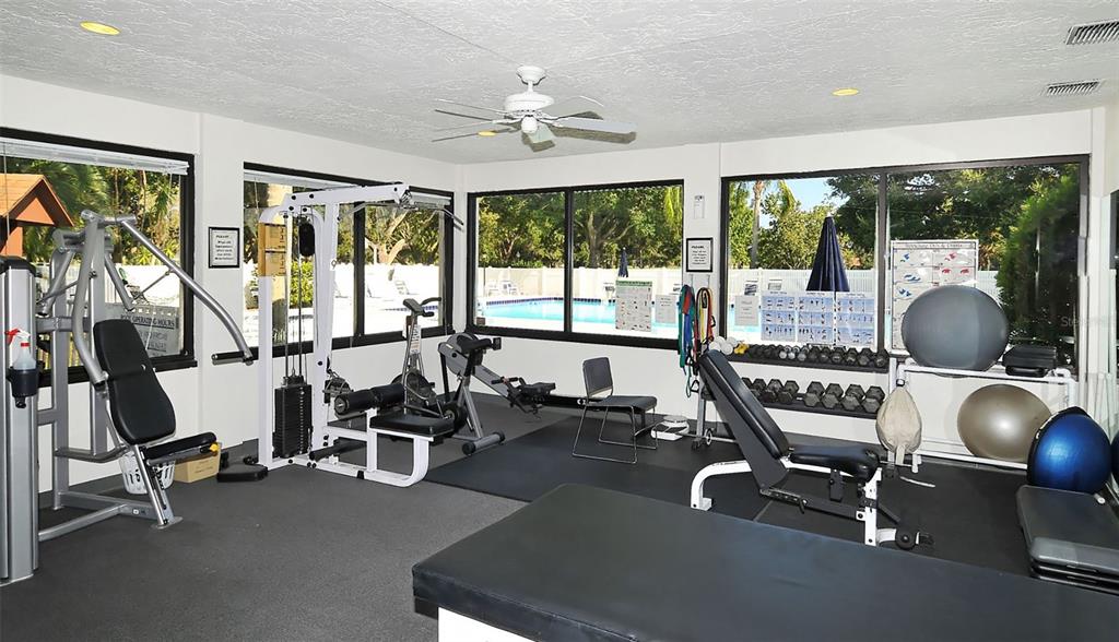 4855 Carrington Circle Sarasota, FL 34243 - Photo 55 of 58 a room with gym equipment and a large window