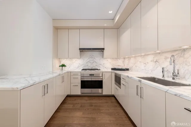 a bathroom with a double vanity sink mirror and shower