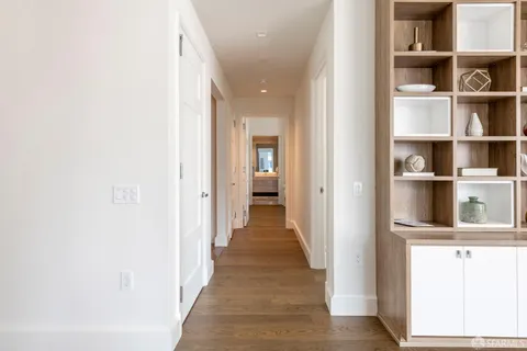 a view of a small space with wooden floor and closet