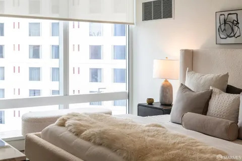 a lobby with furniture and a potted plant