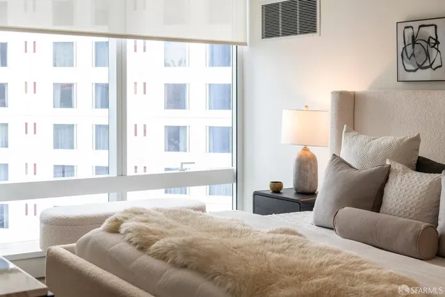 a lobby with furniture and a potted plant