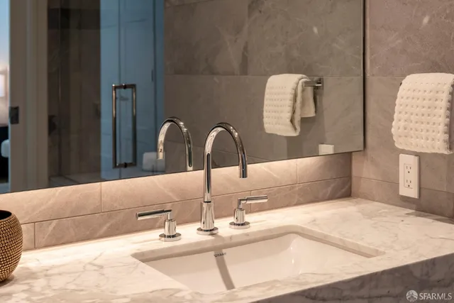 a living room with furniture a rug and a large window