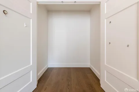 a dining room with furniture a chandelier and window