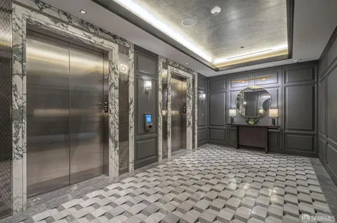 a view of a patio with a table and chairs and potted plants