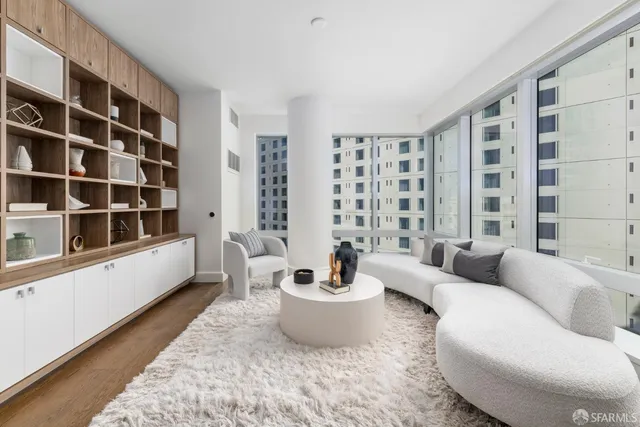 a view of a hallway with cabinets