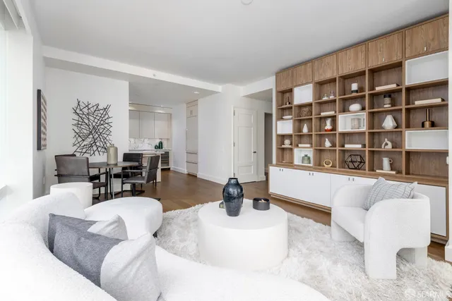 a bedroom with a bed and a chair