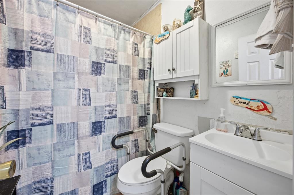 10535 3rd Avenue Ocoee, FL 34761 - Photo 12 of 22 a bathroom with a sink toilet and shower