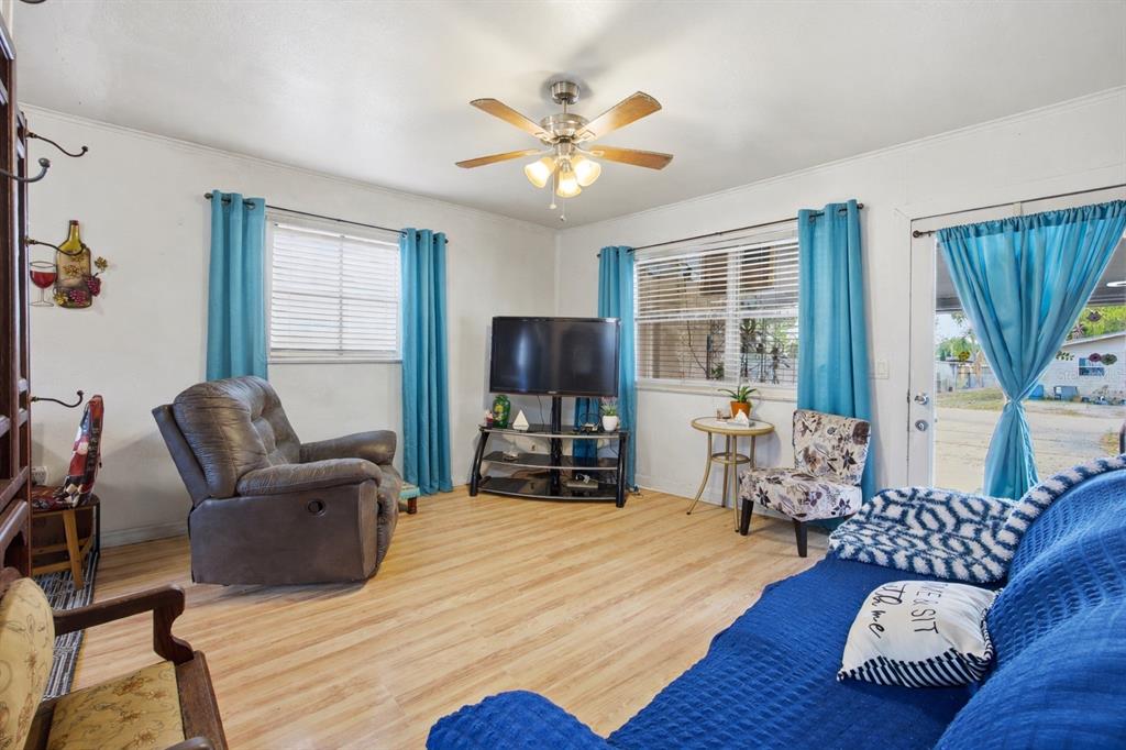 10535 3rd Avenue Ocoee, FL 34761 - Photo 7 of 22 a living room with furniture and a large window