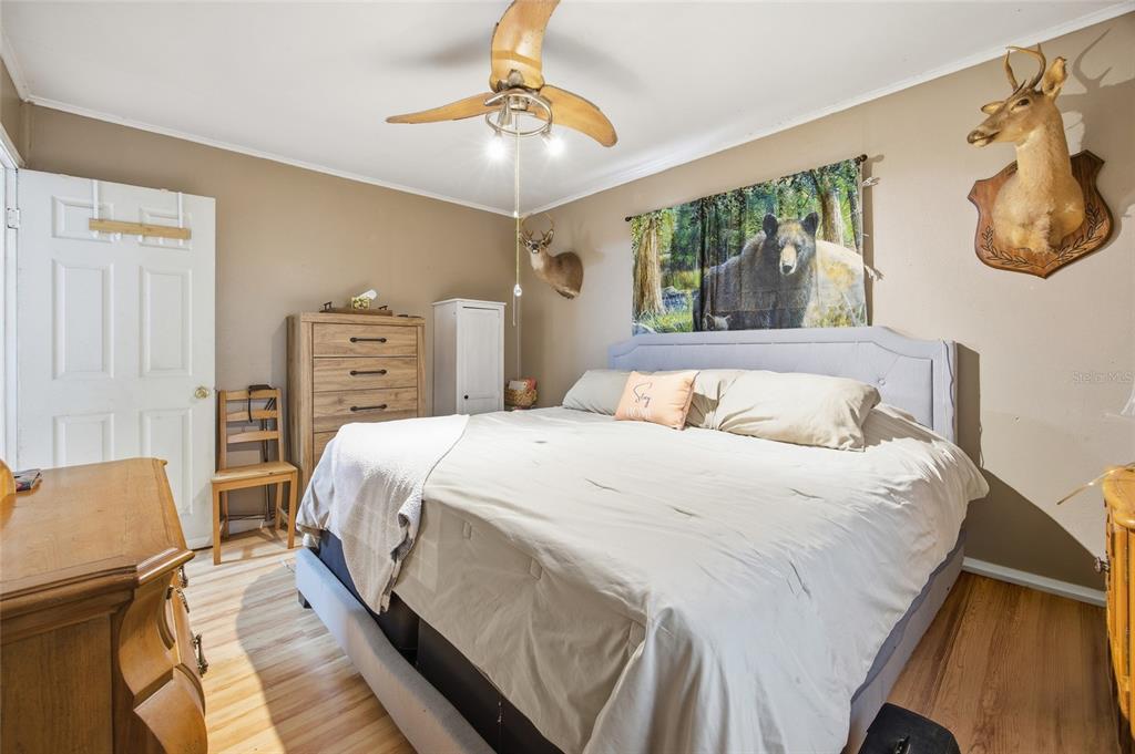 10535 3rd Avenue Ocoee, FL 34761 - Photo 10 of 22 a bed sitting in a bedroom next to a window