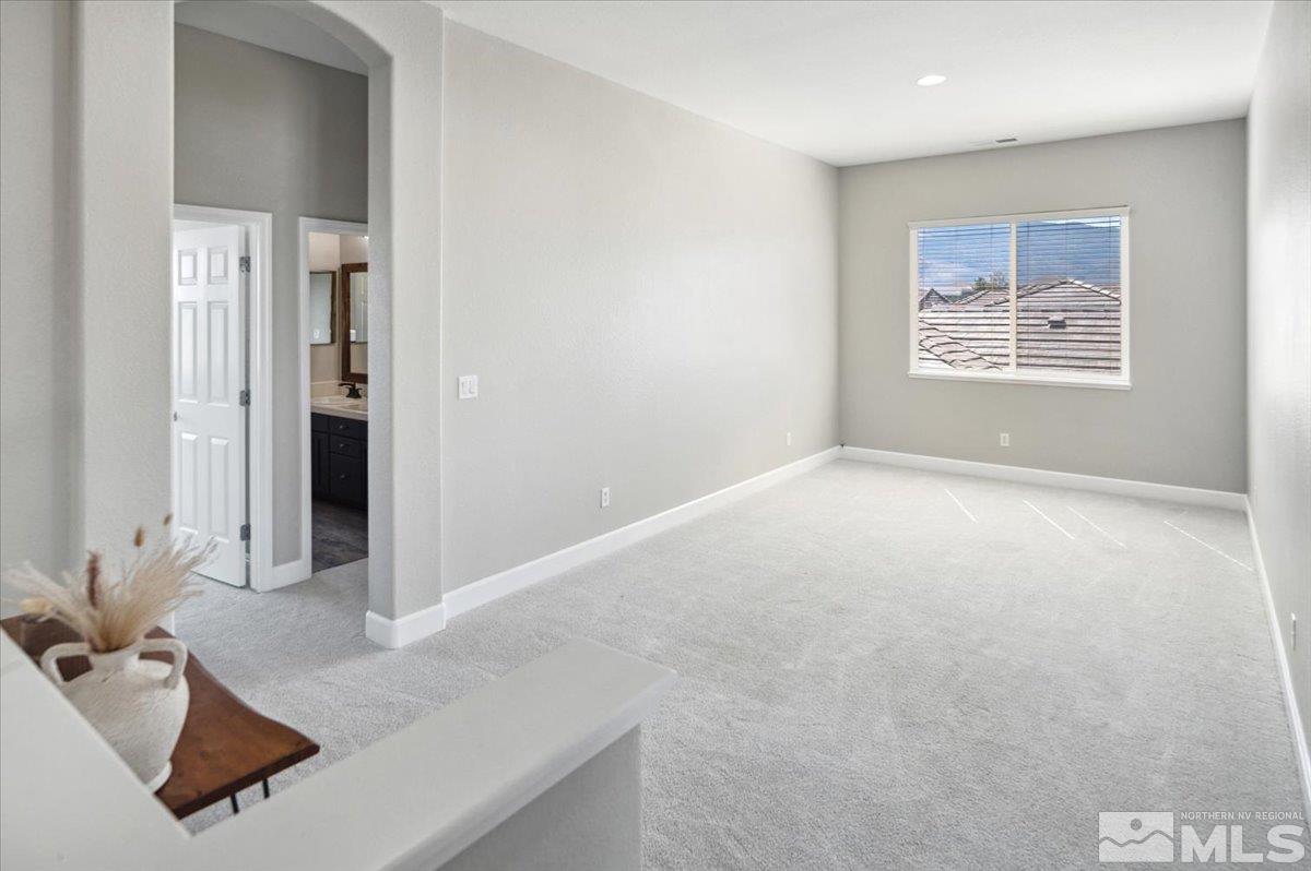 1602 Silver Thread Drive Reno, NV 89521 - Photo 17 of 39 a view of a hallway with workspace