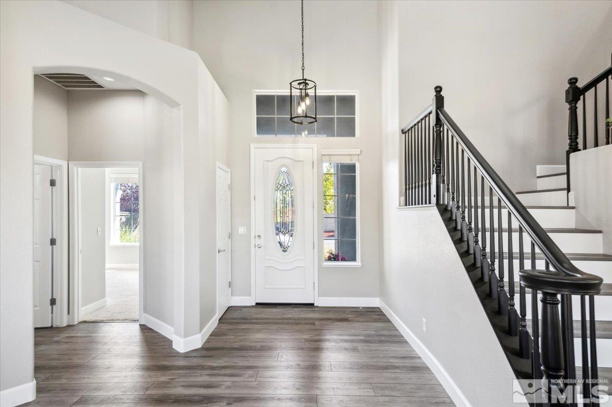 1602 Silver Thread Drive Reno, NV 89521 - Photo 3 of 39 a view of an entryway with wooden floor