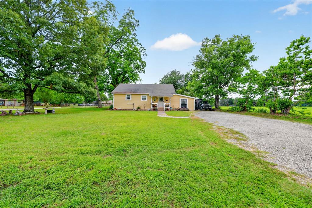 610 Crooked Creek Road Edgewood, TX 75117 - Photo 1 of 33 a aerial view of a house with yard and green space