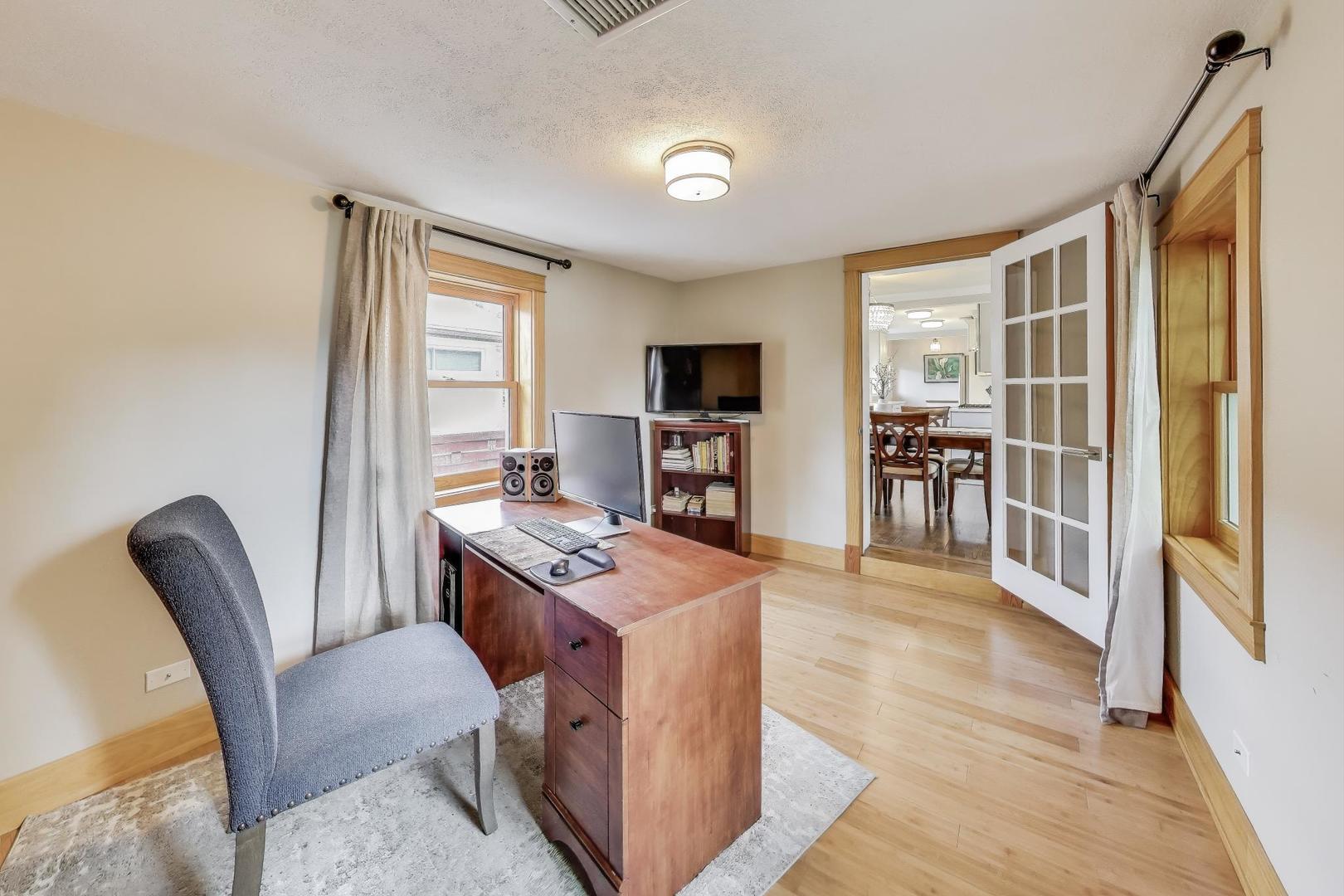 1000 East Lincoln Street Mount Prospect, IL 60056 - Photo 13 of 37 a dining room with furniture and wooden floor