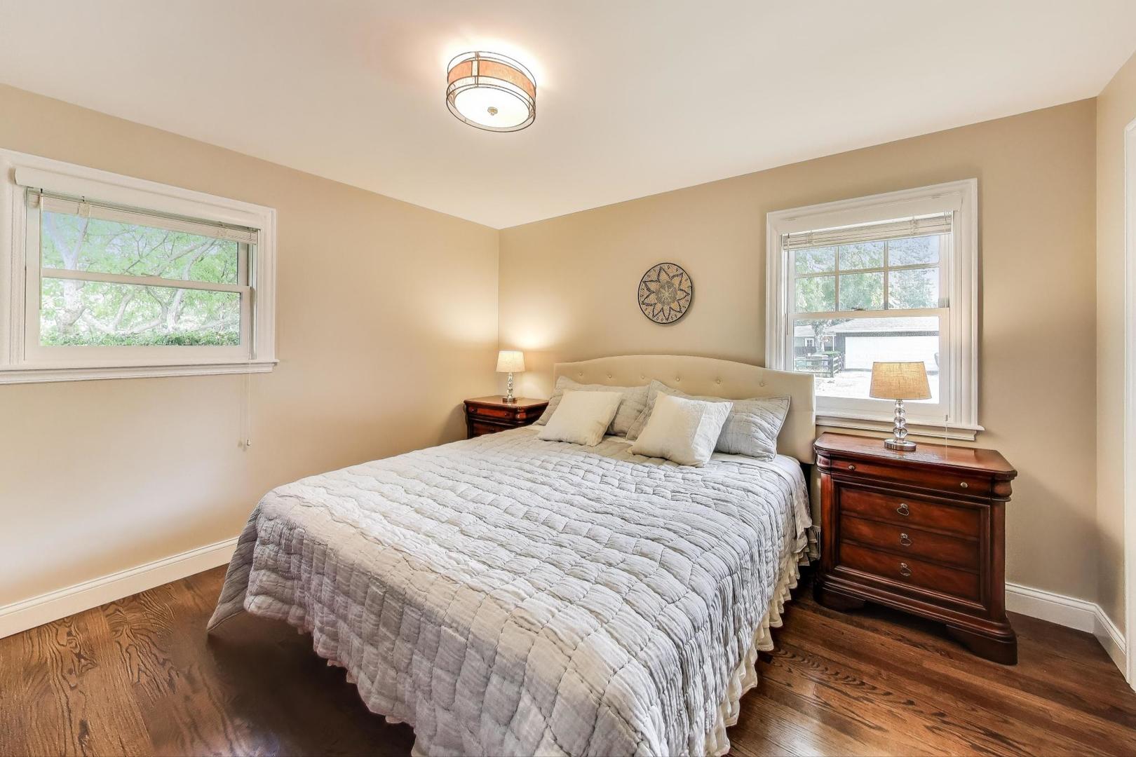 1000 East Lincoln Street Mount Prospect, IL 60056 - Photo 14 of 37 a bedroom with a bed and a window