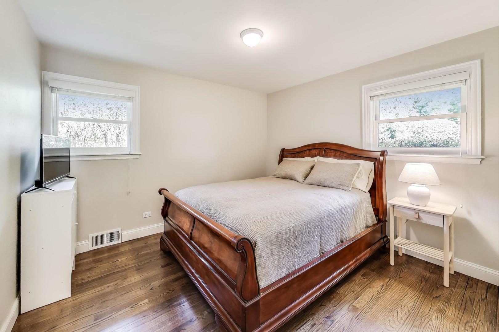 1000 East Lincoln Street Mount Prospect, IL 60056 - Photo 16 of 37 a bedroom with a bed and a window