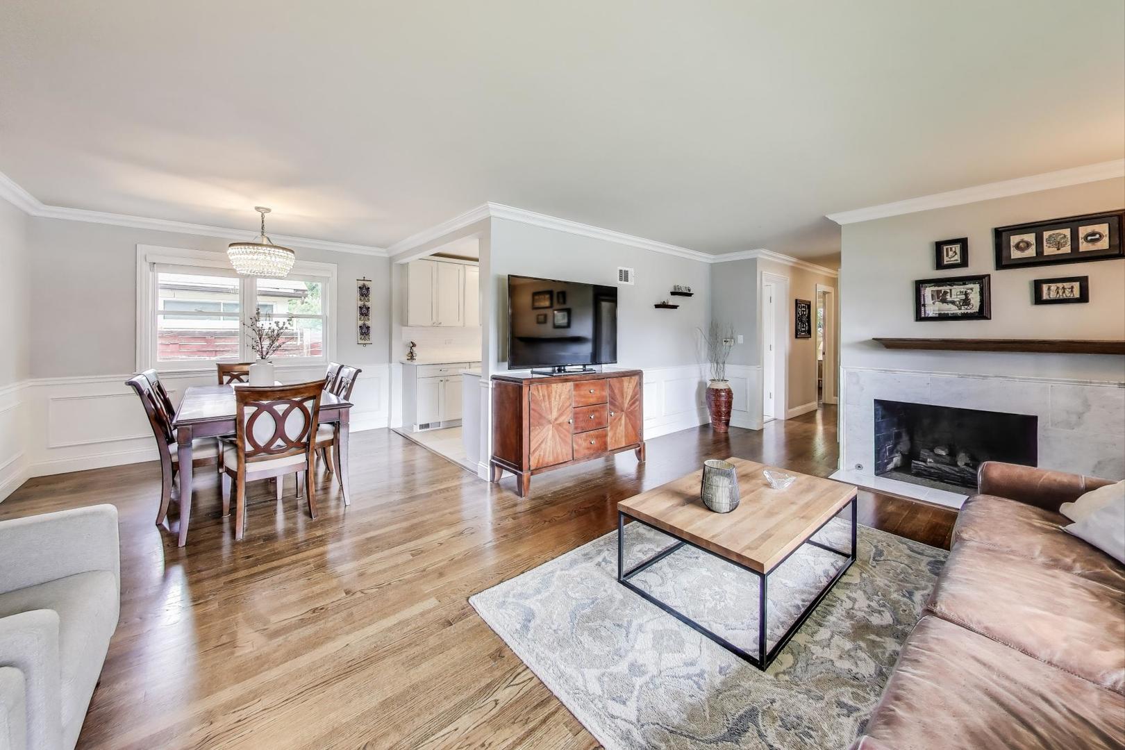 1000 East Lincoln Street Mount Prospect, IL 60056 - Photo 7 of 37 a living room with furniture and a fireplace