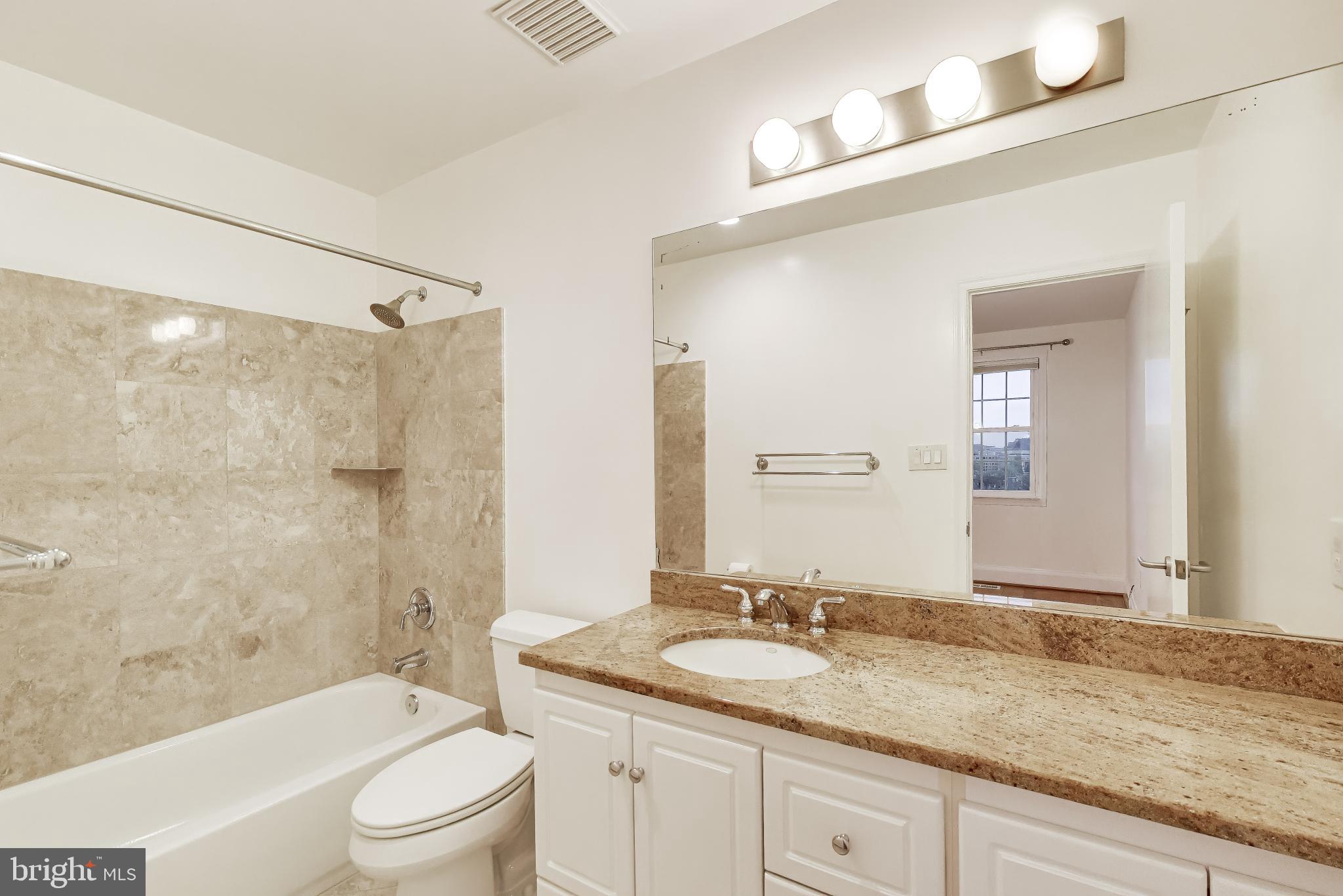 1660 Beekman Place Northwest, Unit A Washington, DC 20009 - Photo 17 of 24 Modern bathroom with elegant finishes.