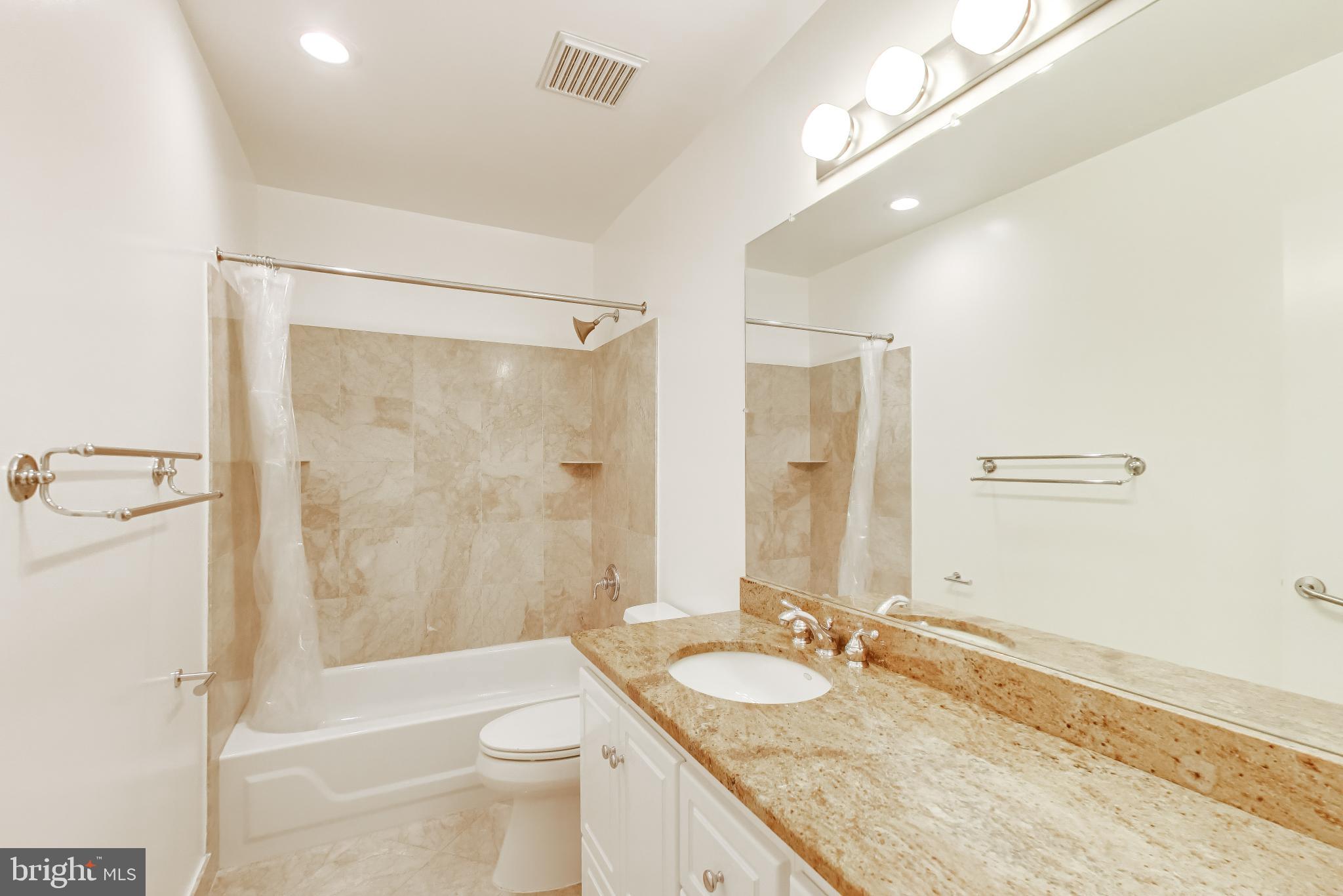 1660 Beekman Place Northwest, Unit A Washington, DC 20009 - Photo 21 of 24 Elegant bathroom with modern finishes.