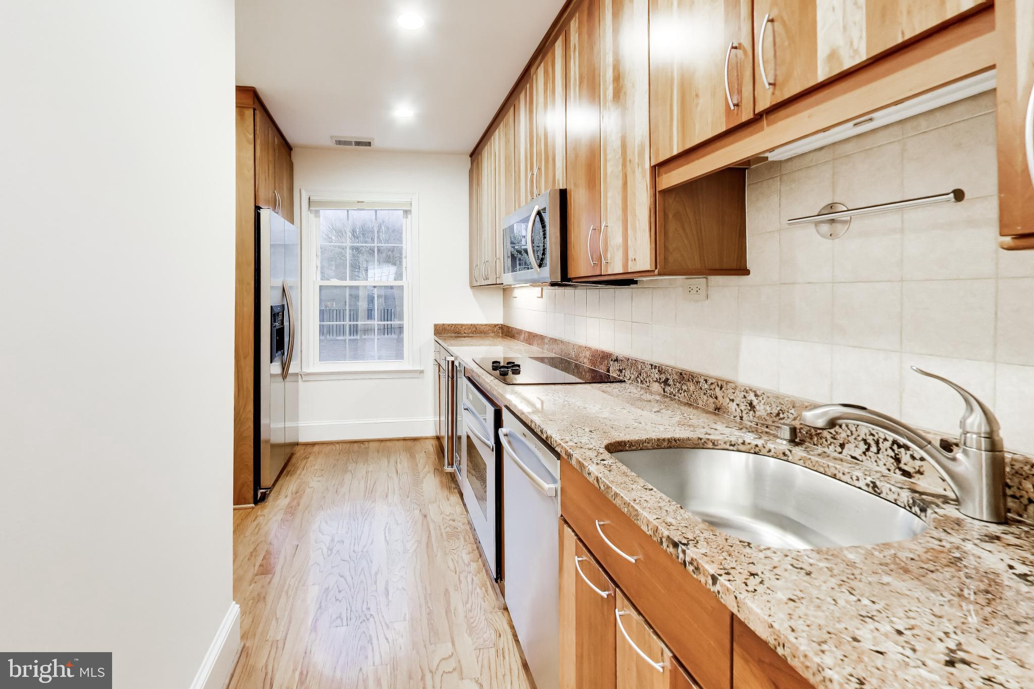 1660 Beekman Place Northwest, Unit A Washington, DC 20009 - Photo 9 of 24 Modern kitchen with sleek finishes.