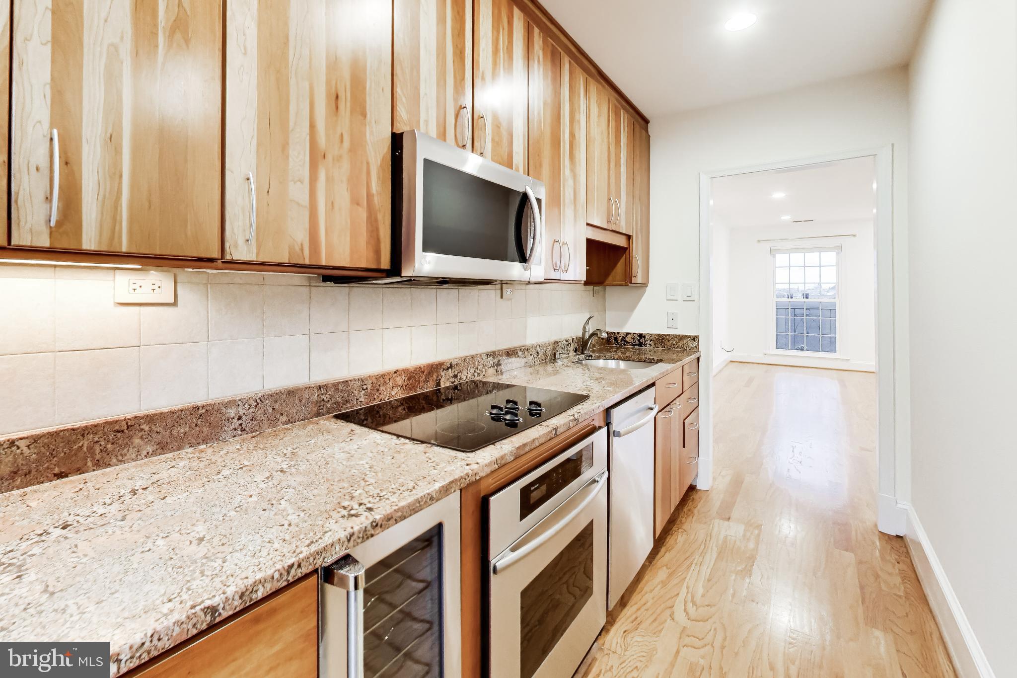1660 Beekman Place Northwest, Unit A Washington, DC 20009 - Photo 10 of 24 Modern kitchen with sleek finishes.