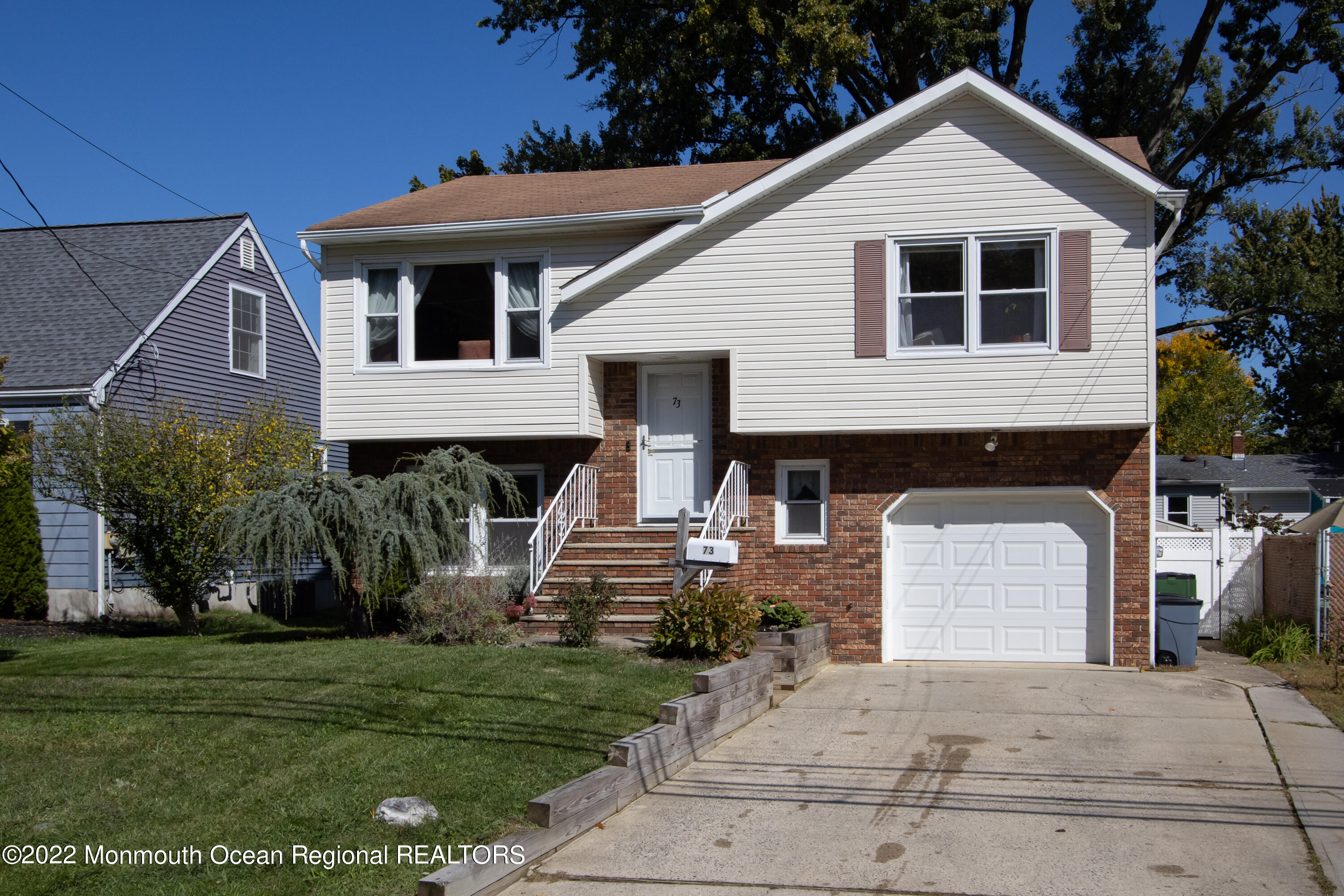 73 Ravine Drive Matawan, NJ 07747 - Photo 2 of 15 a front view of a house with a yard