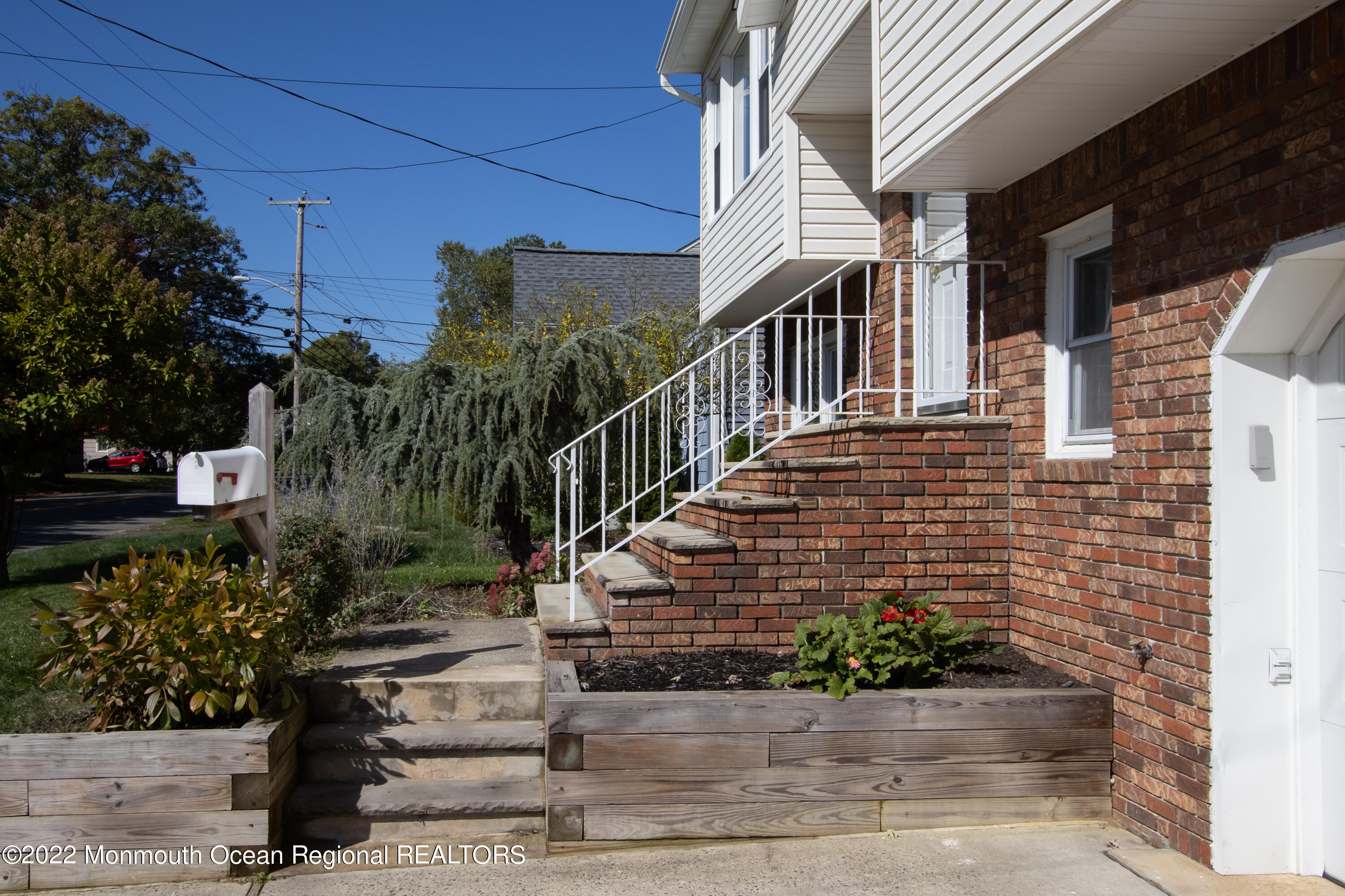 73 Ravine Drive Matawan, NJ 07747 - Photo 3 of 15 a view of a house with stairs and plants
