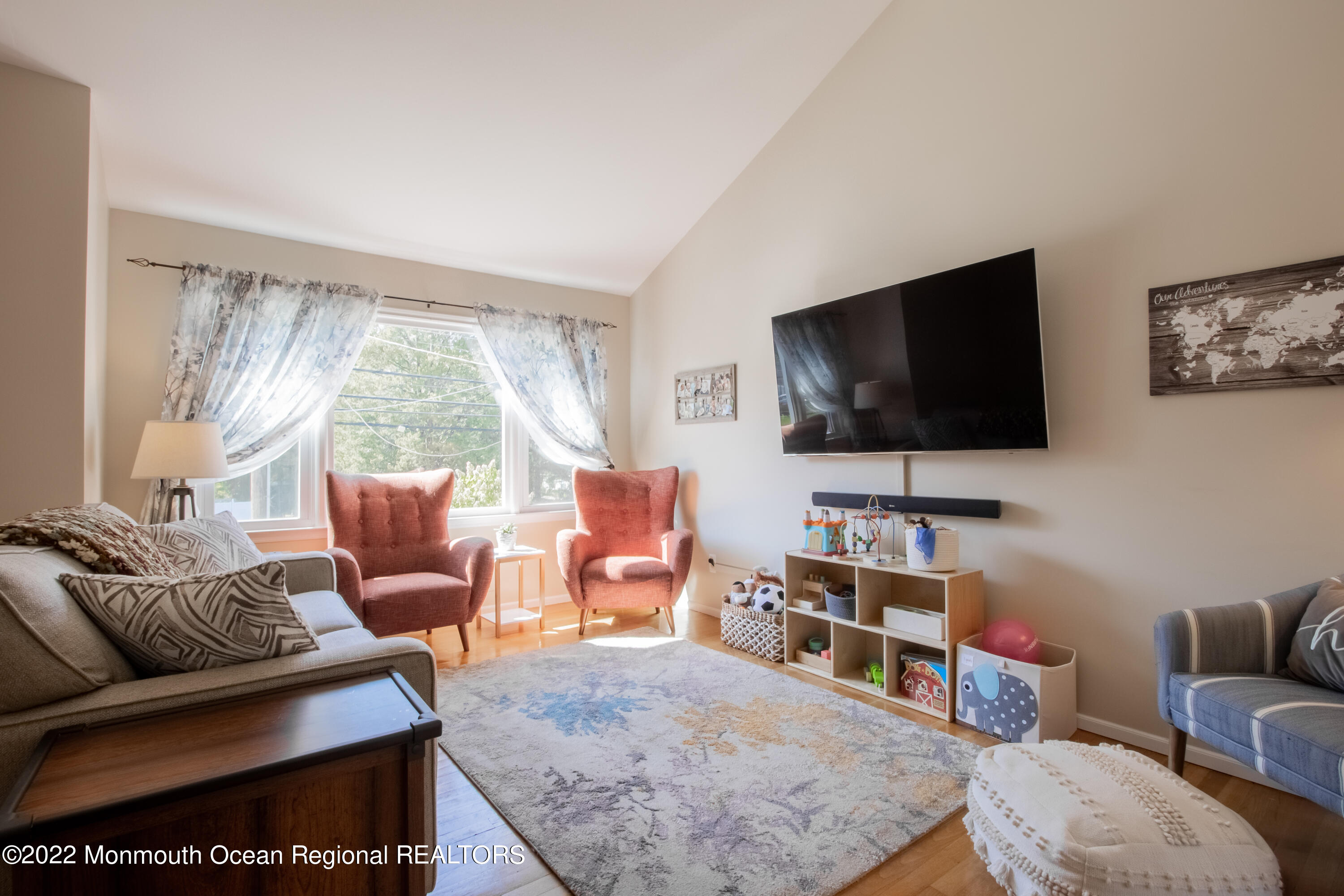 73 Ravine Drive Matawan, NJ 07747 - Photo 4 of 15 a living room with furniture and a flat screen tv