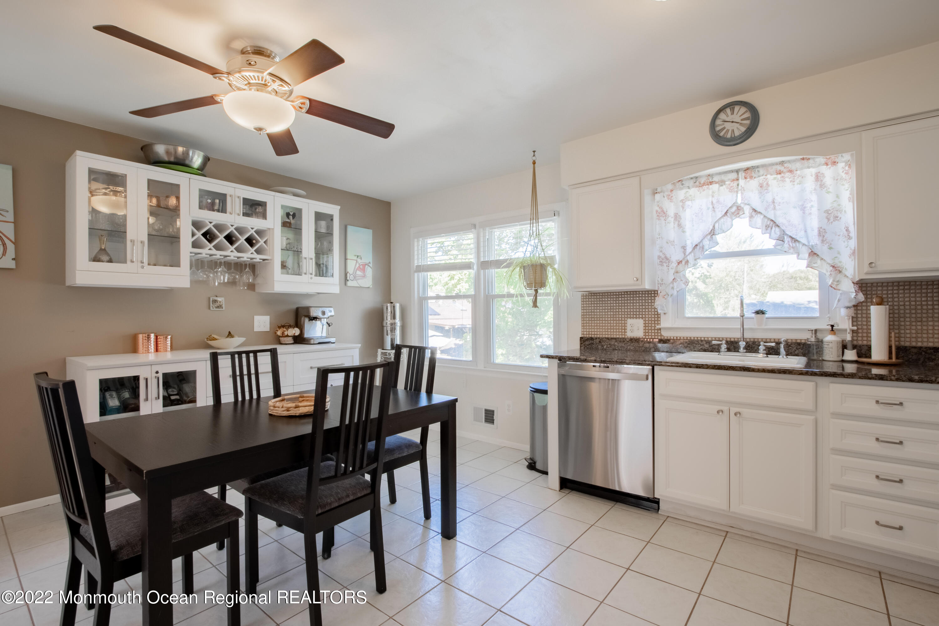 73 Ravine Drive Matawan, NJ 07747 - Photo 6 of 15 a kitchen with a dining table chairs and window