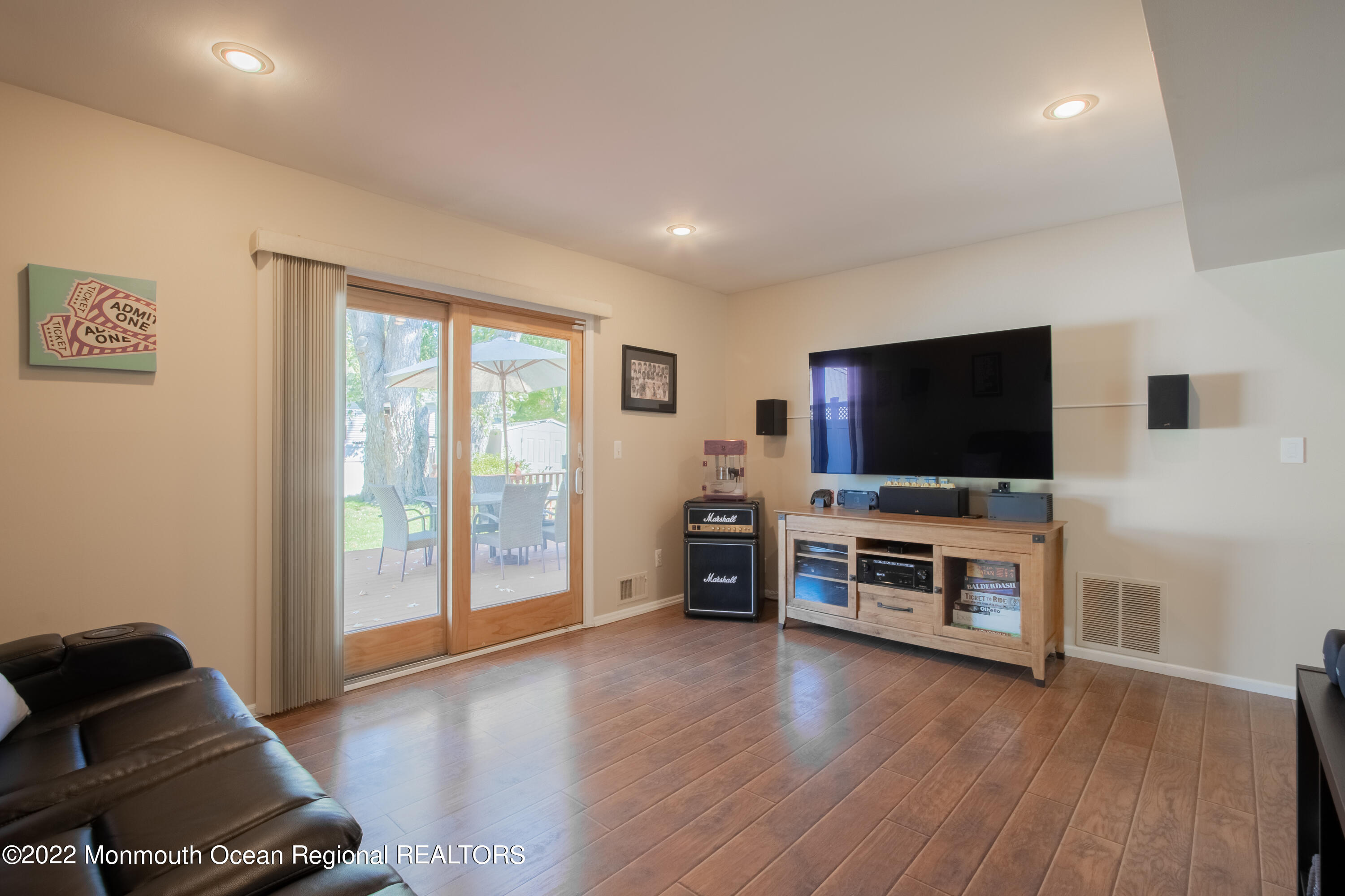 73 Ravine Drive Matawan, NJ 07747 - Photo 9 of 15 a living room with furniture and a flat screen tv