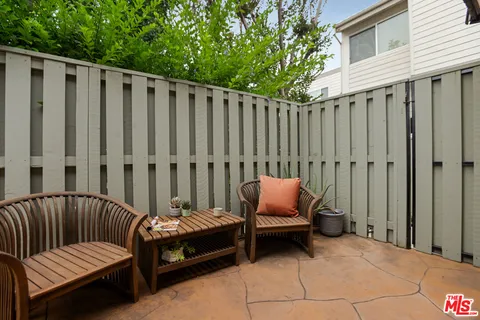 a view of outdoor space with lounge chair