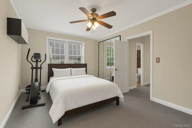 a bedroom with a bed and a tv